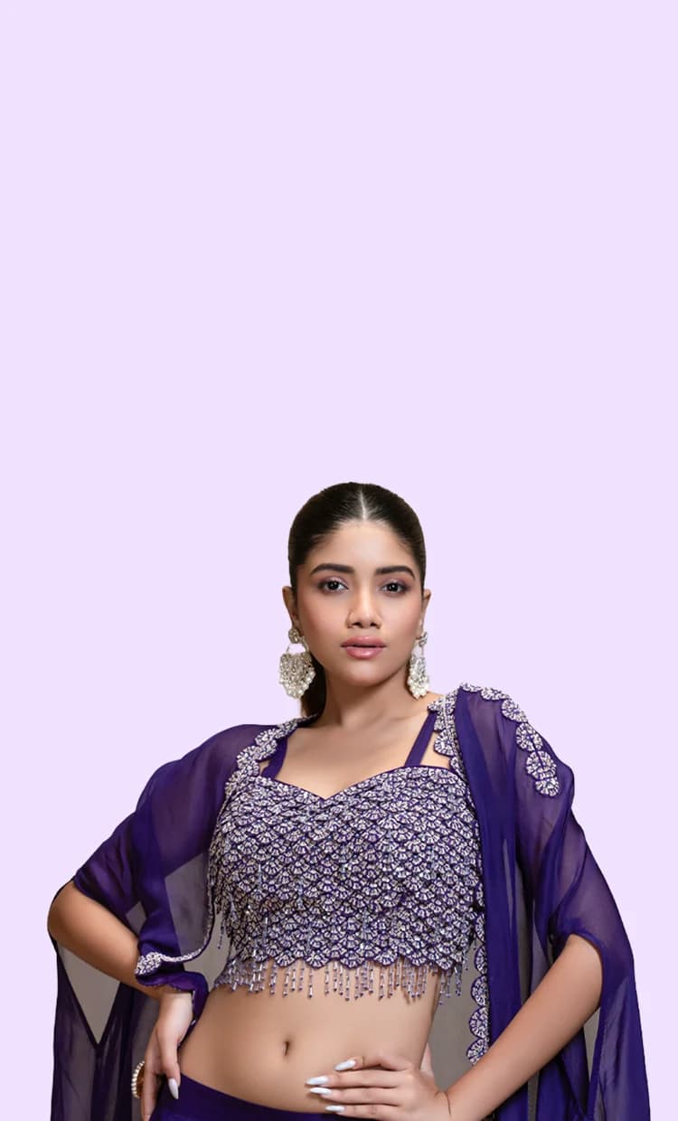 RUDRAYANI model wearing a deep violet hand-embroidered lehenga
