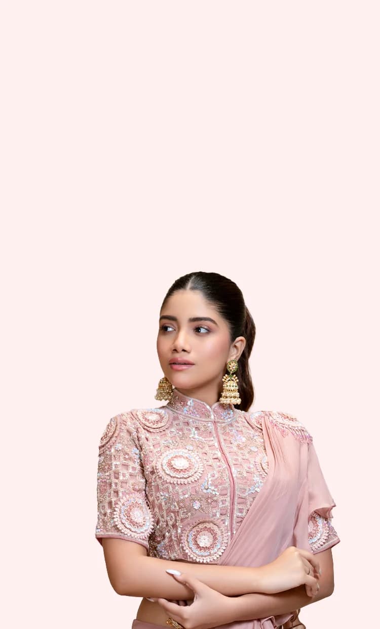 RUDRAYANI model wearing a blush pink embroidered saree