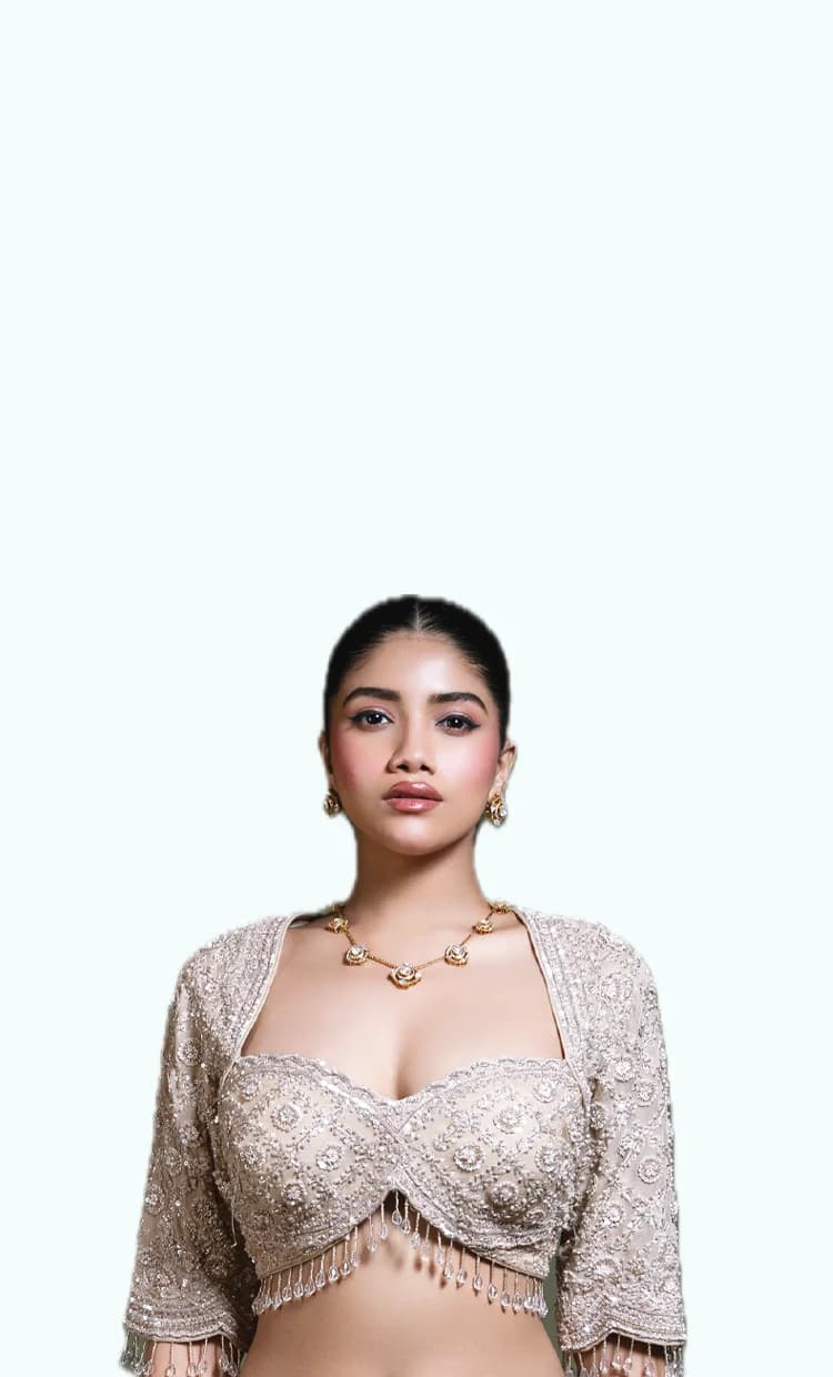 RUDRAYANI model wearing an ivory hand-embroidered blouse