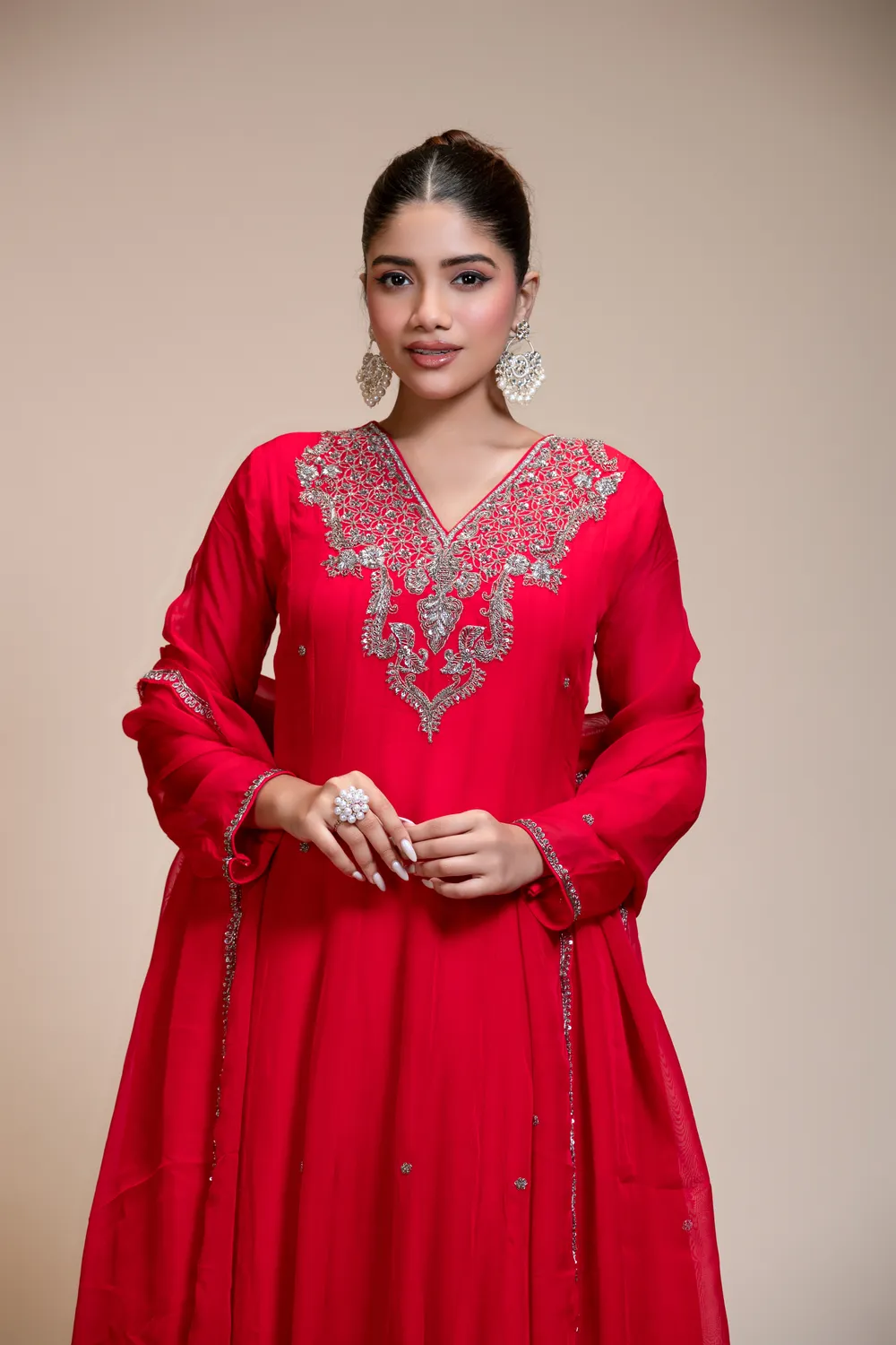 RUDRAYANI model wearing a red organza anarkali with an embroidered yoke