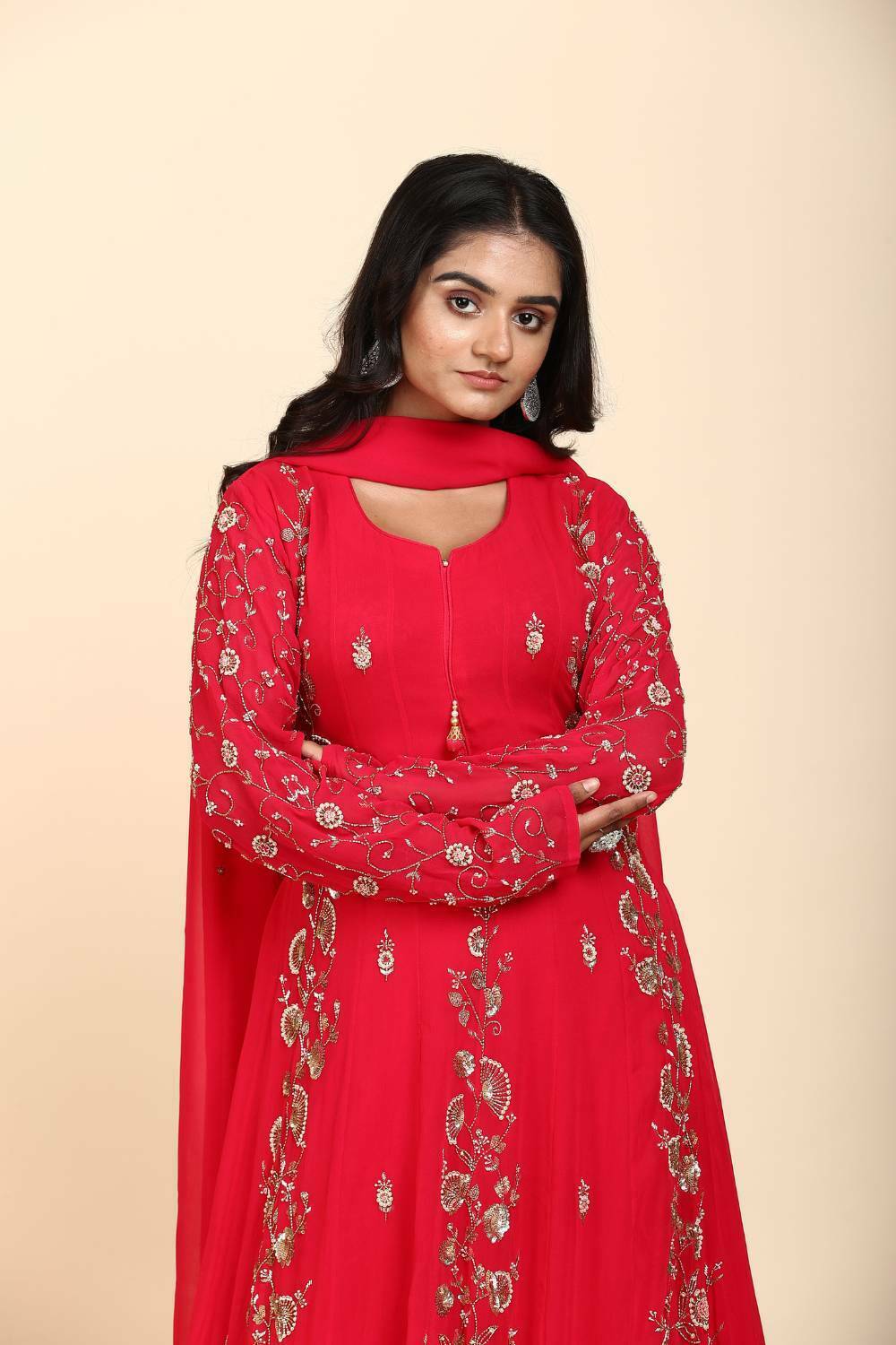 Red Georgette Anarkali with panel design and moti work in a traditional Indian outfit
